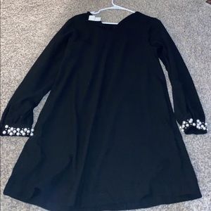 Long sleeve black dress with pearl cuffs